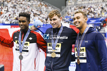 2023-07-30 - Josh Liendo of Canada Silver medal, Maxime Grousset of France Gold medal, Dare Rose of United States Bronze medal, Men's 100m Butterfly Medal Ceremony during the 20th FINA Swimming World Championships Fukuoka 2023 on July 29, 2023 at Marine Messe Fukuoka in Fukuoka, Japan - SWIMMING - WORLD CHAMPIONSHIPS 2023 - SWIMMING - SWIMMING