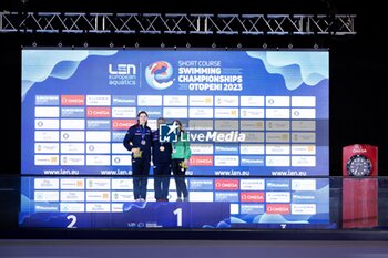 05/12/2023 - Abbie Wood of Great Britain, Colbert Freya of Great Britain and Walshe Ellen of Irleland during the prize giving ceremony for Women’s 400m Individual Medley at the LEN Short Course European Championships 2023 on December 5, 2023 in Otopeni, Romania - SWIMMING - LEN SHORT COURSE EUROPEAN CHAMPIONSHIPS 2023 - NUOTO - NUOTO