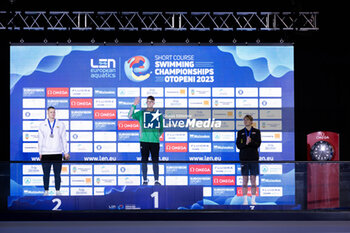 2023-12-05 - Wiffen Daniel of Ireland, Rapsys Danas of Lithuania and Henveaux Lucas of Belgium during the prize giving ceremony for Men’s 400m Freestyle at the LEN Short Course European Championships 2023 on December 5, 2023 in Otopeni, Romania - SWIMMING - LEN SHORT COURSE EUROPEAN CHAMPIONSHIPS 2023 - SWIMMING - SWIMMING