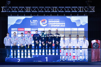 05/12/2023 - Team of Great Britain, Team of Italy and Team of Greece during the prize giving ceremony for Men´s 4x50m Freestyle at the LEN Short Course European Championships 2023 on December 5, 2023 in Otopeni, Romania - SWIMMING - LEN SHORT COURSE EUROPEAN CHAMPIONSHIPS 2023 - NUOTO - NUOTO
