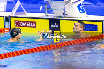 2023-12-06 - Manaudou Florent of France congratulating Zazzeri Lorenzo of Italy during Men´s 50m Freestyle Semifinal 1 at the LEN Short Course European Championships 2023 on December 6, 2023 in Otopeni, Romania - SWIMMING - LEN SHORT COURSE EUROPEAN CHAMPIONSHIPS 2023 - DAY 2 - SWIMMING - SWIMMING