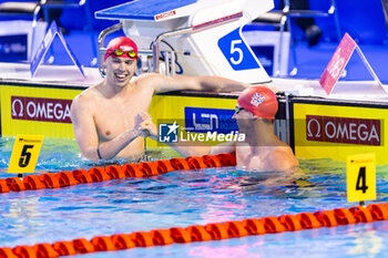 2023-12-06 - Burras Lewis of Great Britain congratulating Proud Benjamin of Great Britain during Men´s 50m Freestyle Semifinal 2 at the LEN Short Course European Championships 2023 on December 6, 2023 in Otopeni, Romania - SWIMMING - LEN SHORT COURSE EUROPEAN CHAMPIONSHIPS 2023 - DAY 2 - SWIMMING - SWIMMING