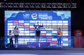 06/12/2023 - Jefimova Eneli of Estonia, Pilato Benedetta of Italy and Schouten Tes of the Netherlands during the podium ceremony for Women’s 100m Breaststroke at the LEN Short Course European Championships 2023 on December 6, 2023 in Otopeni, Romania - SWIMMING - LEN SHORT COURSE EUROPEAN CHAMPIONSHIPS 2023 - DAY 2 - NUOTO - NUOTO