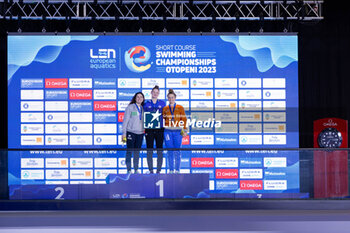 2023-12-06 - Jefimova Eneli of Estonia, Pilato Benedetta of Italy and Schouten Tes of the Netherlands during the podium ceremony for Women’s 100m Breaststroke at the LEN Short Course European Championships 2023 on December 6, 2023 in Otopeni, Romania - SWIMMING - LEN SHORT COURSE EUROPEAN CHAMPIONSHIPS 2023 - DAY 2 - SWIMMING - SWIMMING