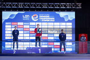 06/12/2023 - Ponti Noe of Switzerland, Grousset Maxime of France and Peters Jacob of Great Britain during the podium ceremony for Men’s 100m Butterfly at the LEN Short Course European Championships 2023 on December 6, 2023 in Otopeni, Romania - SWIMMING - LEN SHORT COURSE EUROPEAN CHAMPIONSHIPS 2023 - DAY 2 - NUOTO - NUOTO
