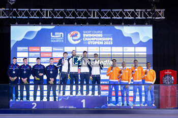 06/12/2023 - Team Italy, Team Great Britain and Team Netherlands during the podium ceremony for Men’s 4X50m Medley Relay at the LEN Short Course European Championships 2023 on December 6, 2023 in Otopeni, Romania - SWIMMING - LEN SHORT COURSE EUROPEAN CHAMPIONSHIPS 2023 - DAY 2 - NUOTO - NUOTO