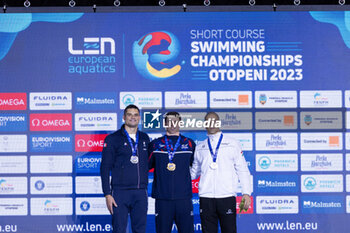 2023-12-07 - Proud Benjamin of Great Britain, Manaudou Florent of France and Szabo Szebasztian of Hungary during the podium ceremony for Men’s 50m Freestyle at the LEN Short Course European Championships 2023 on December 7, 2023 in Otopeni, Romania - SWIMMING - LEN SHORT COURSE EUROPEAN CHAMPIONSHIPS 2023 - DAY 3 - SWIMMING - SWIMMING