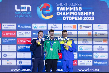 07/12/2023 - Wiffen Daniel of Ireland, Aubry David of France and Romanchuk Mykhailo of Ukraine during the podium ceremony for Men’s 1500m Freestyle at the LEN Short Course European Championships 2023 on December 7, 2023 in Otopeni, Romania - SWIMMING - LEN SHORT COURSE EUROPEAN CHAMPIONSHIPS 2023 - DAY 3 - NUOTO - NUOTO