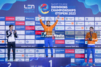 07/12/2023 - Kamminga Arno of the Netherlands, Martinenghi Nicolo of Italy and Corbeau Caspar of the Netherlands during the podium ceremony for Men’s 100m Breaststroke at the LEN Short Course European Championships 2023 on December 7, 2023 in Otopeni, Romania - SWIMMING - LEN SHORT COURSE EUROPEAN CHAMPIONSHIPS 2023 - DAY 3 - NUOTO - NUOTO