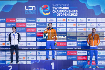 2023-12-07 - Kamminga Arno of the Netherlands, Martinenghi Nicolo of Italy and Corbeau Caspar of the Netherlands during the podium ceremony for Men’s 100m Breaststroke at the LEN Short Course European Championships 2023 on December 7, 2023 in Otopeni, Romania - SWIMMING - LEN SHORT COURSE EUROPEAN CHAMPIONSHIPS 2023 - DAY 3 - SWIMMING - SWIMMING