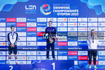 2023-12-08 - Scott Duncan of Great Britain, Razzetti Alberto of Italy and Rapsys Danas of Lithuania during the podium ceremony for Men’s 200m Individual Medley at the LEN Short Course European Championships 2023 on December 8, 2023 in Otopeni, Romania - SWIMMING - LEN SHORT COURSE EUROPEAN CHAMPIONSHIPS 2023 - DAY 4 - SWIMMING - SWIMMING