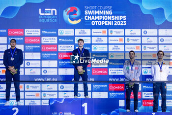 2023-12-08 - Tomac Mewen of France, Ndoye-Brouard Yohann of France, Mora Lorenzo of Italy and Ungur Daniel of Romania during the podium celebration for Men’s 100m Backstroke at the LEN Short Course European Championships 2023 on December 8, 2023 in Otopeni, Romania - SWIMMING - LEN SHORT COURSE EUROPEAN CHAMPIONSHIPS 2023 - DAY 4 - SWIMMING - SWIMMING