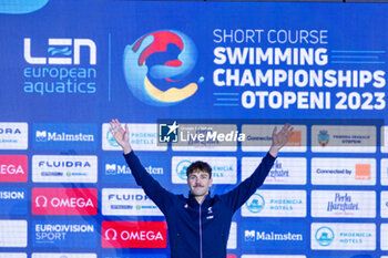 08/12/2023 - Tomac Mewen of France during the podium celebration for Men’s 100m Backstroke at the LEN Short Course European Championships 2023 on December 8, 2023 in Otopeni, Romania - SWIMMING - LEN SHORT COURSE EUROPEAN CHAMPIONSHIPS 2023 - DAY 4 - NUOTO - NUOTO