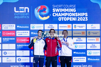 08/12/2023 - Ponti Noe of Switzerland, Razzetti Alberto if Italy and Marton Richard of Hungary during the podium ceremony for Men’s 200m Butterfly at the LEN Short Course European Championships 2023 on December 8, 2023 in Otopeni, Romania - SWIMMING - LEN SHORT COURSE EUROPEAN CHAMPIONSHIPS 2023 - DAY 4 - NUOTO - NUOTO