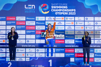 09/12/2023 - Toussaint Kira of the Netherlands, Harris Medi of Great Britain and Moluh Mary-Ambre of France during the podium ceremony for Women’s 100m Backstroke at the LEN Short Course European Championships 2023 on December 9, 2023 in Otopeni, Romania - SWIMMING - LEN SHORT COURSE EUROPEAN CHAMPIONSHIPS 2023 - DAY 5 - NUOTO - NUOTO