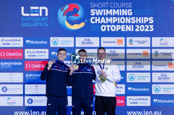09/12/2023 - Richards Matthew of Great Britain, Guy James of Great Britain and Rapsys Danas of Lithuania during the podoium ceremony for Men’s 200m Freestyle at the LEN Short Course European Championships 2023 on December 9, 2023 in Otopeni, Romania - SWIMMING - LEN SHORT COURSE EUROPEAN CHAMPIONSHIPS 2023 - DAY 5 - NUOTO - NUOTO