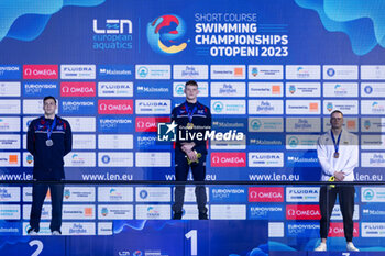 09/12/2023 - Richards Matthew of Great Britain, Guy James of Great Britain and Rapsys Danas of Lithuania during the podoium ceremony for Men’s 200m Freestyle at the LEN Short Course European Championships 2023 on December 9, 2023 in Otopeni, Romania - SWIMMING - LEN SHORT COURSE EUROPEAN CHAMPIONSHIPS 2023 - DAY 5 - NUOTO - NUOTO