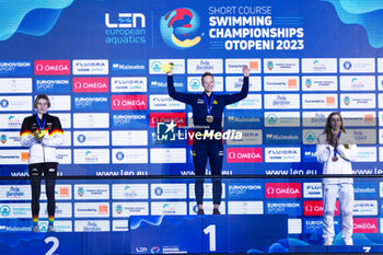2023-12-09 - Hansson Louise of Sweden, Kohler Angelina of Germany and Ntountounaki Anna of Greece during the podium ceremony for Women’s 100m Butterfly at the LEN Short Course European Championships 2023 on December 9, 2023 in Otopeni, Romania - SWIMMING - LEN SHORT COURSE EUROPEAN CHAMPIONSHIPS 2023 - DAY 5 - SWIMMING - SWIMMING