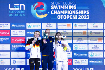 2023-12-09 - Hansson Louise of Sweden, Kohler Angelina of Germany and Ntountounaki Anna of Greece during the podium ceremony for Women’s 100m Butterfly at the LEN Short Course European Championships 2023 on December 9, 2023 in Otopeni, Romania - SWIMMING - LEN SHORT COURSE EUROPEAN CHAMPIONSHIPS 2023 - DAY 5 - SWIMMING - SWIMMING