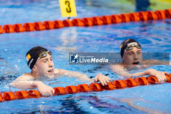 2023-12-10 - Wiffen Daniel of Ireland and his brother Wiffen Nathan of Ireland celebrating winning and setting the new World Record during Men’s 800m Freestyle Final at the LEN Short Course European Championships 2023 on December 10, 2023 in Otopeni, Romania - SWIMMING - LEN SHORT COURSE EUROPEAN CHAMPIONSHIPS 2023 - DAY 6 - SWIMMING - SWIMMING