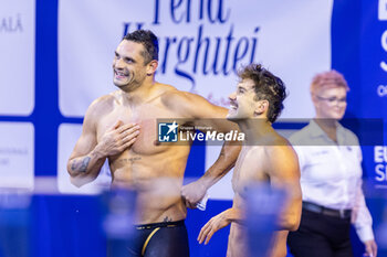 2023-12-10 - Grousset Maxime, Manaudou Florent of France after getting second palce during Mixed 4x50m Medley Relay Final at the LEN Short Course European Championships 2023 on December 10, 2023 in Otopeni, Romania - SWIMMING - LEN SHORT COURSE EUROPEAN CHAMPIONSHIPS 2023 - DAY 6 - SWIMMING - SWIMMING