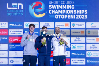 2023-12-10 - Grousset Maxime of France, Miressi Alessandro of Italy and David Popovici of Romania during the podium ceremony for Men’s 100m Freestyle at the LEN Short Course European Championships 2023 on December 10, 2023 in Otopeni, Romania - SWIMMING - LEN SHORT COURSE EUROPEAN CHAMPIONSHIPS 2023 - DAY 6 - SWIMMING - SWIMMING