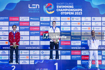 2023-12-10 - Reitshammer Bernhard of Austria, Ponti Noe of Switzerland and Vazaios Andreas of Greece during the podium ceremony for Men’s 100m Individual Medley at the LEN Short Course European Championships 2023 on December 10, 2023 in Otopeni, Romania - SWIMMING - LEN SHORT COURSE EUROPEAN CHAMPIONSHIPS 2023 - DAY 6 - SWIMMING - SWIMMING