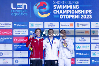 10/12/2023 - Reitshammer Bernhard of Austria, Ponti Noe of Switzerland and Vazaios Andreas of Greece during the podium ceremony for Men’s 100m Individual Medley at the LEN Short Course European Championships 2023 on December 10, 2023 in Otopeni, Romania - SWIMMING - LEN SHORT COURSE EUROPEAN CHAMPIONSHIPS 2023 - DAY 6 - NUOTO - NUOTO