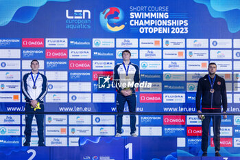 2023-12-10 - Nicolo Martinenghi of Italy, Cerasuolo Simone of Italy and Sakci Emre of Turkey during the podium ceremony for Men’s 50m Breaststroke at the LEN Short Course European Championships 2023 on December 10, 2023 in Otopeni, Romania - SWIMMING - LEN SHORT COURSE EUROPEAN CHAMPIONSHIPS 2023 - DAY 6 - SWIMMING - SWIMMING