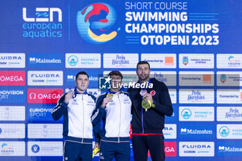 10/12/2023 - Nicolo Martinenghi of Italy, Cerasuolo Simone of Italy and Sakci Emre of Turkey during the podium ceremony for Men’s 50m Breaststroke at the LEN Short Course European Championships 2023 on December 10, 2023 in Otopeni, Romania - SWIMMING - LEN SHORT COURSE EUROPEAN CHAMPIONSHIPS 2023 - DAY 6 - NUOTO - NUOTO