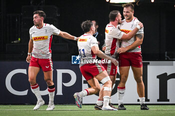 2023-12-10 - Andre ESTERHUIZEN of Harlequins celebrate his try with teammates during the Investec Champions Cup, Pool 2 rugby union match between Racing 92 and Harlequins on December 10, 2023 at Paris La Defense Arena in Nanterre, France - RUGBY - CHAMPIONS CUP - RACING 92 V HARLEQUINS - CHAMPIONS CUP - RUGBY
