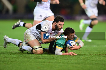 2023-12-15 - Toulon RC back row Charles Ollivon (7) tackles Northampton Saints fullback George Furbank (15) during the Champions Cup, rugby union match between Northampton Saints and RC Toulon on 15 December 2023 at Franklins Gardens in Northampton, England - RUGBY - CHAMPIONS CUP - NORTHAMPTON V TOULON - CHAMPIONS CUP - RUGBY