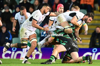 2023-12-15 - Toulon RC back row Charles Ollivon (7) is tackled by Northampton Saints hooker Curtis Langdon (2) during the Champions Cup, rugby union match between Northampton Saints and RC Toulon on 15 December 2023 at Franklins Gardens in Northampton, England - RUGBY - CHAMPIONS CUP - NORTHAMPTON V TOULON - CHAMPIONS CUP - RUGBY