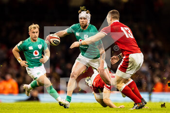 04/02/2023 - Mack Hansen of Ireland under pressure from George North of Wales during the Six Nations 2023, rugby union match between Wales and Ireland on February 4, 2023 at Millenium Stadium in Cardiff, Wales - RUGBY - SIX NATIONS 2023 - WALES V IRELAND - 6 NAZIONI - RUGBY