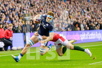 11/02/2023 - Jamie Ritchie of Scotland is tackled by Jow Hawkins of Wales during the Six Nations 2023, rugby union match between Scotland and Wales on February 11, 2023 at BT Murrayfield Stadium in Edinburgh, Scotland - RUGBY - SIX NATIONS 2023 - SCOTLAND V WALES - 6 NAZIONI - RUGBY