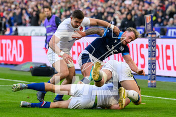 26/02/2023 - Stuart Hogg and Kyle Steyn of Scotland tackle Ethan Dumortier of France during the Six Nations 2023 rugby union match between France and Scotland on 26 February 2023 at Stade de France in Saint-Denis near Paris, France - RUGBY - SIX NATIONS 2023 - FRANCE V SCOTLAND - 6 NAZIONI - RUGBY