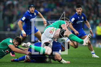 25/02/2023 - Peter O'Mahony of Ireland jumps over Sebastian Negri of Italy during the Six Nations 2023 rugby union match between Italy and Ireland on February 25, 2023 at Stadio Olimpico in Rome, Italy - RUGBY - SIX NATIONS 2023 - ITALY V IRELAND - 6 NAZIONI - RUGBY