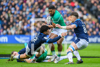 12/03/2023 - Bundee Aki of Ireland is tackled by Sione Tuipulotu of Scotland and Jack Dempsey of Scotland during the Six Nations 2023 rugby union match between Scotland and Ireland on 12 March 2023 at BT Murrayfield in Edinburgh, Scotland - RUGBY - SIX NATIONS 2023 - SCOTLAND V IRELAND - 6 NAZIONI - RUGBY