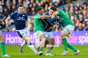 2023-03-12 - Sione Tuipulotu of Scotland is tackled by Bundee Aki and Jack Conan of Ireland during the Six Nations 2023 rugby union match between Scotland and Ireland on 12 March 2023 at BT Murrayfield in Edinburgh, Scotland - RUGBY - SIX NATIONS 2023 - SCOTLAND V IRELAND - SIX NATIONS - RUGBY