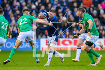 12/03/2023 - Finn Russell of Scotland tries to slip the tackle of Ross Byrne of Ireland during the Six Nations 2023 rugby union match between Scotland and Ireland on 12 March 2023 at BT Murrayfield in Edinburgh, Scotland - RUGBY - SIX NATIONS 2023 - SCOTLAND V IRELAND - 6 NAZIONI - RUGBY