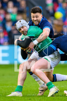 12/03/2023 - Mack Hansen of Ireland is tackled by Ali Price of Scotland during the Six Nations 2023 rugby union match between Scotland and Ireland on 12 March 2023 at BT Murrayfield in Edinburgh, Scotland - RUGBY - SIX NATIONS 2023 - SCOTLAND V IRELAND - 6 NAZIONI - RUGBY