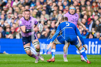 2023-03-18 - Matt Fagerson of Scotland runs at Federico Ruzza of Italy during the Six Nations 2023 rugby union match between Scotland and Italy on 18 March 2023 at the BT Murrayfield Stadium in Edinburgh, Scotland - RUGBY - SIX NATIONS 2023 - SCOTLAND V ITALY - SIX NATIONS - RUGBY