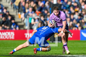 2023-03-18 - Ollie Smith of Scotland is tackled by Pietro Ceccarelli of Italy during the Six Nations 2023 rugby union match between Scotland and Italy on 18 March 2023 at the BT Murrayfield Stadium in Edinburgh, Scotland - RUGBY - SIX NATIONS 2023 - SCOTLAND V ITALY - SIX NATIONS - RUGBY