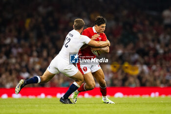 2023-08-05 - Louis Rees-Zammit of Wales is tackled by Guy Porter of England during the Summer Nations Series 2023, rugby union match between Wales and England on 5 August 2023 at Millenium Stadium in Cardiff, Wales - RUGBY - SUMMER NATIONS SERIES 2023 - WALES V ENGLAND - TEST MATCH - RUGBY