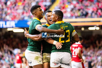 2023-08-19 - Damian Willemse of South Africa celebrates scoring his sides eighth try with team-mates Jesse Kriel & Canan Moodie during the Summer Nations Series 2023, Rugby Union Friendly match between Wales and South Africa on 19 August 2023 at Principality Stadium in Cardiff, Wales - RUGBY - SUMMER NATIONS SERIES 2023 - WALES V SOUTH AFRICA - TEST MATCH - RUGBY