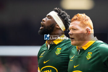 2023-08-19 - Siya Kolisi of South Africa with team-mate Steven Kitshoff sing their anthem before the Summer Nations Series 2023, Rugby Union Friendly match between Wales and South Africa on 19 August 2023 at Principality Stadium in Cardiff, Wales - RUGBY - SUMMER NATIONS SERIES 2023 - WALES V SOUTH AFRICA - TEST MATCH - RUGBY