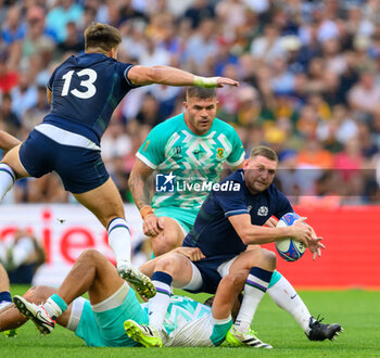 2023-09-10 - Finn Russell of Scotland is tackled during the World Cup 2023, Pool B rugby union match between South Africa and Scotland on September 10, 2023 at Velodrome stadium in Marseille, France - RUGBY - WORLD CUP 2023 - SOUTH AFRICA V SCOTLAND - WORLD CUP - RUGBY