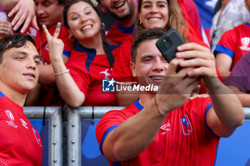 2023-09-16 - Santiago Videla of Chile, Benjamin Videla of Chile taking a selfie with a fan during the Rugby World Cup France 2023 match between Samoa and Chile at Stade de Bordeaux on September 16, 2023 in Bordeaux, France. Photo by Hans van der Valk/ Orange Pictures / DPPI - RUGBY - WORLD CUP 2023 - SAMOA V CHILE - WORLD CUP - RUGBY