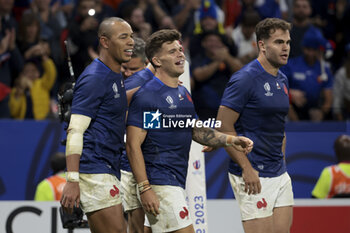 2023-10-06 - Matthieu Jalibert of France celebrates scoring a try between Gael Fickou, Damian Penaud of France during the World Cup 2023, Pool A rugby union match between France and Italy on October 6, 2023 at Groupama Stadium in Decines-Charpieu near Lyon, France - RUGBY - WORLD CUP 2023 - FRANCE V ITALY - WORLD CUP - RUGBY