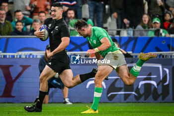 2023-10-14 - Will JORDAN of New Zealand and Hugo KEENAN of Ireland during the World Cup 2023, Quarter-final rugby union match between Ireland and New Zealand on October 14, 2023 at Stade de France in Saint-Denis near Paris, France - RUGBY - WORLD CUP 2023 - 1/4 - IRELAND V NEW ZEALAND - WORLD CUP - RUGBY